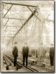 Bill Hart McNesby and Tabor Stamper (L-R) at the railroad bridge in Farmers, KY